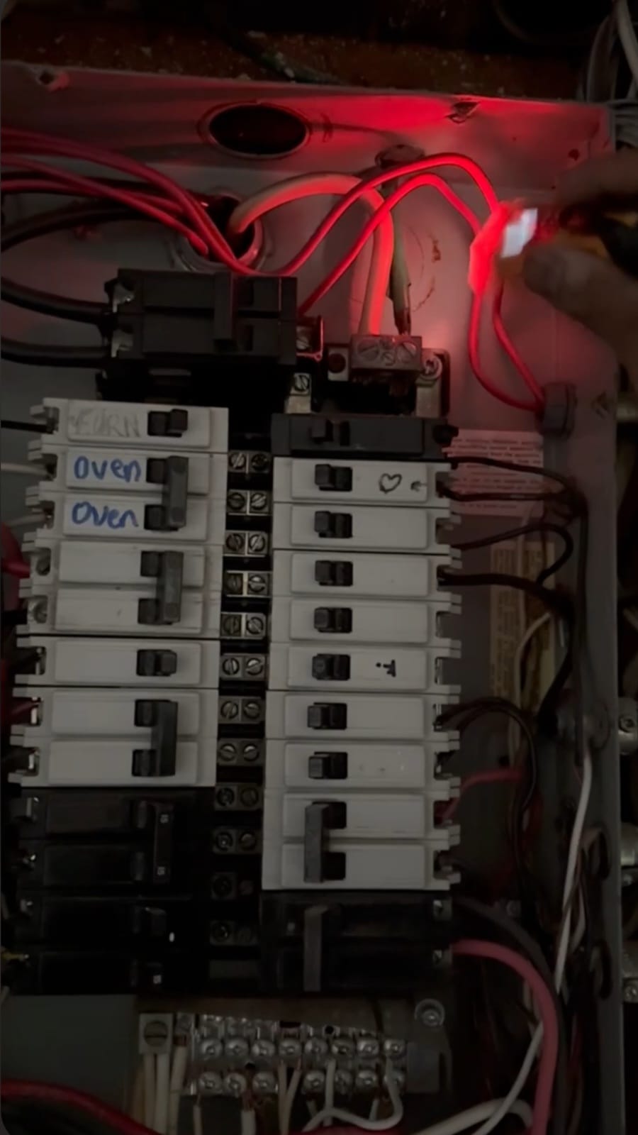 Electrical panel diagnostic with torch light revealing wiring issues in a Toronto home — The HandyForce