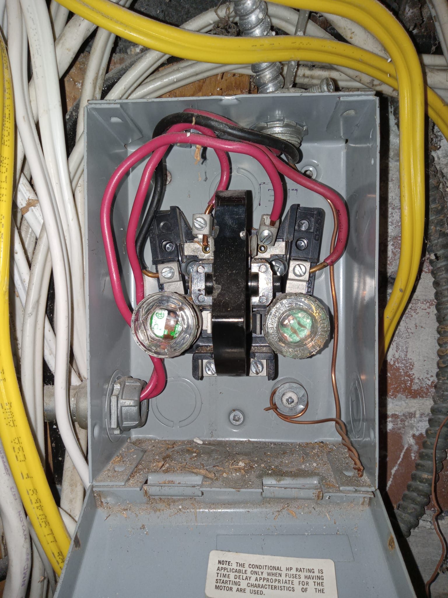 Old fuse sub-panel with exposed wiring in a Toronto home — electrical upgrade by The HandyForce