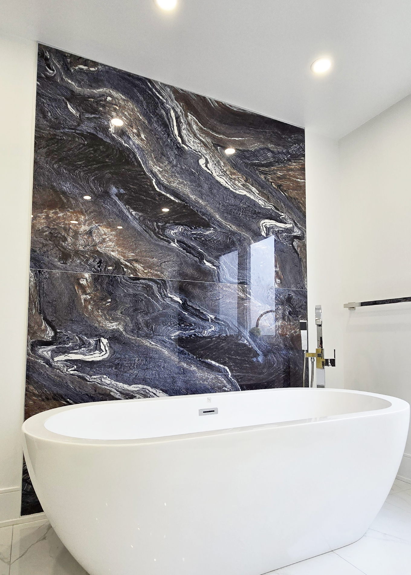 Large format porcelain tile installation in a Toronto home by The HandyForce - floor-to-ceiling showstopper slab tile In North York